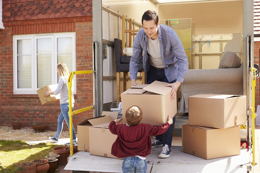 Family unpacking and moving house