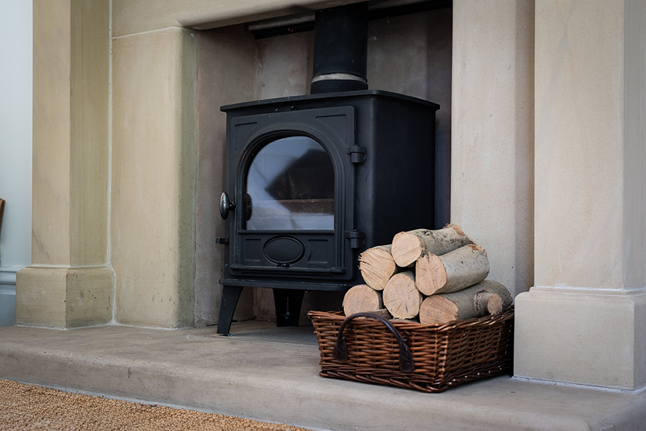Photo of log burner and stone hearth